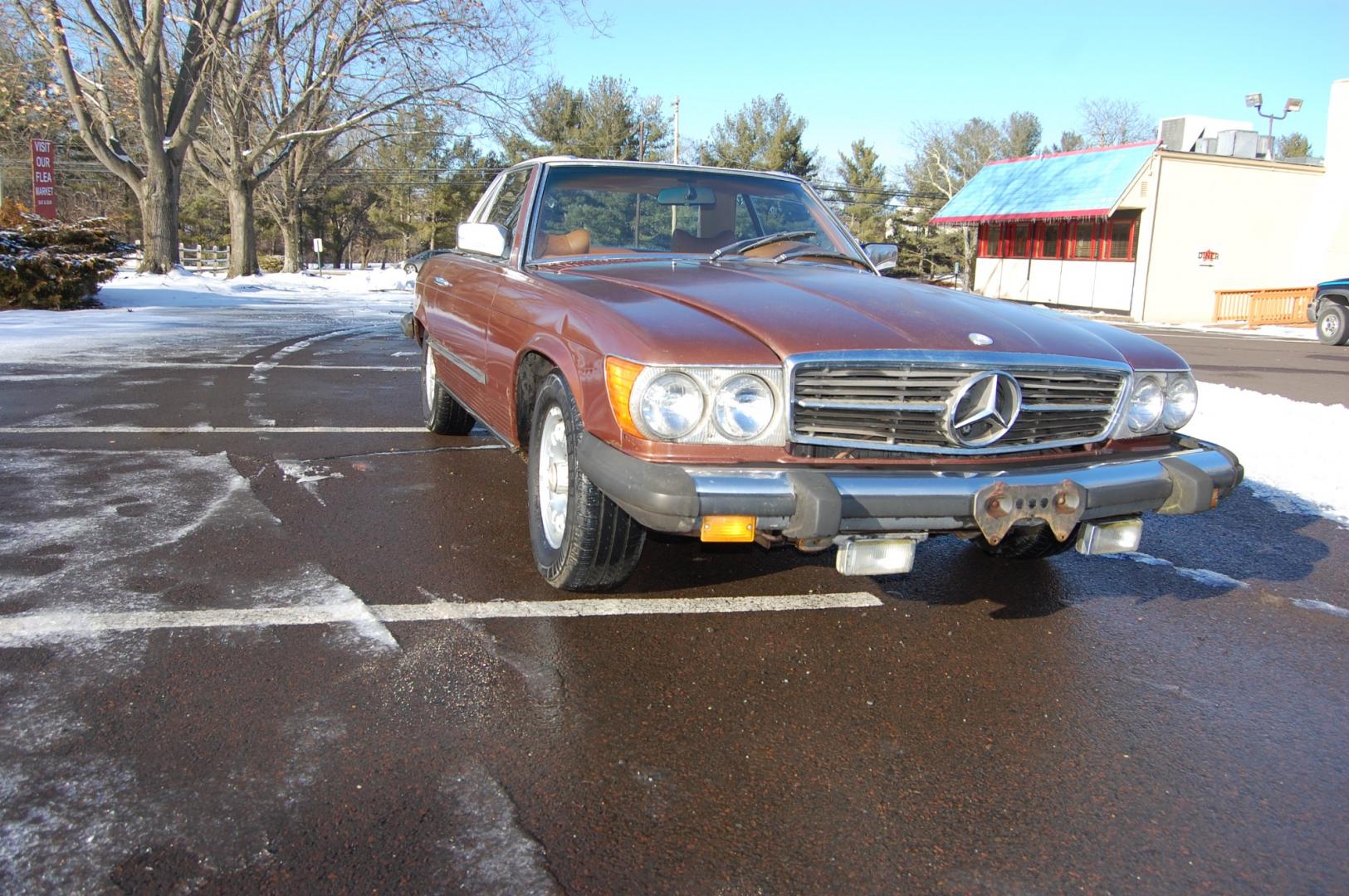 1976 Brown /Brown Leather Mercedes-Benz 450SL (10704412030) with an 4.5L V8 engine, Automatic transmission, located at 6528 Lower York Road, New Hope, PA, 18938, (215) 862-9555, 40.358707, -74.977882 - Here we have a nice 1976 Mercedes 450SL convertible with a 4.5L V8 engine putting power to the rear wheels via an automatic transmission. Some options on this vehicle include brown leather, wood trim, power windows, removable hard top, heat, A/C, AM/FM radio, cruise control, wood steering wheel, 14 - Photo#8